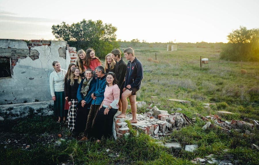 A large extended family gathered together outdoors