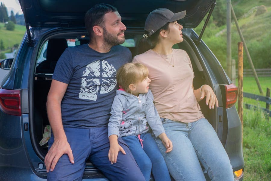 A family taking photos on a trip