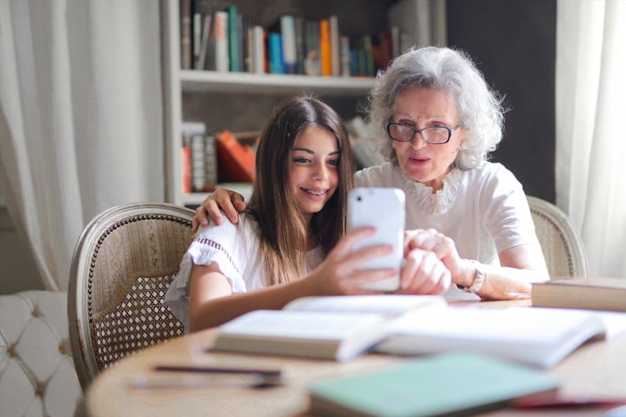 Grandparents looking at family photos