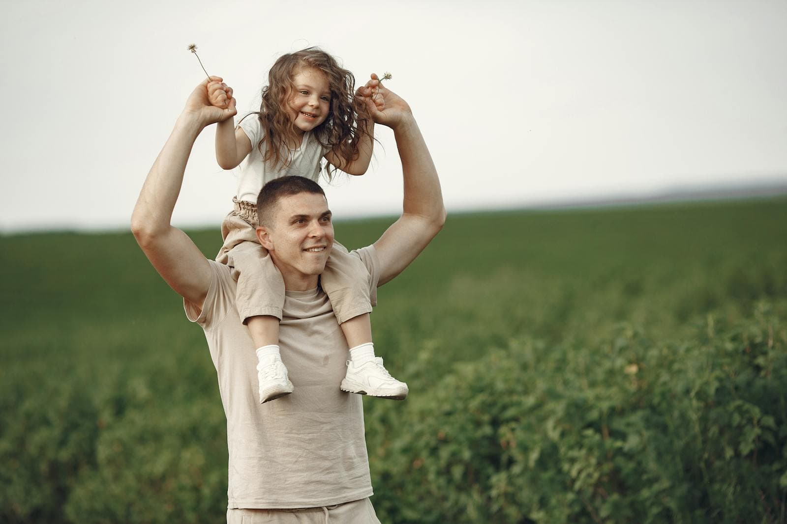 A parent and child laughing together
